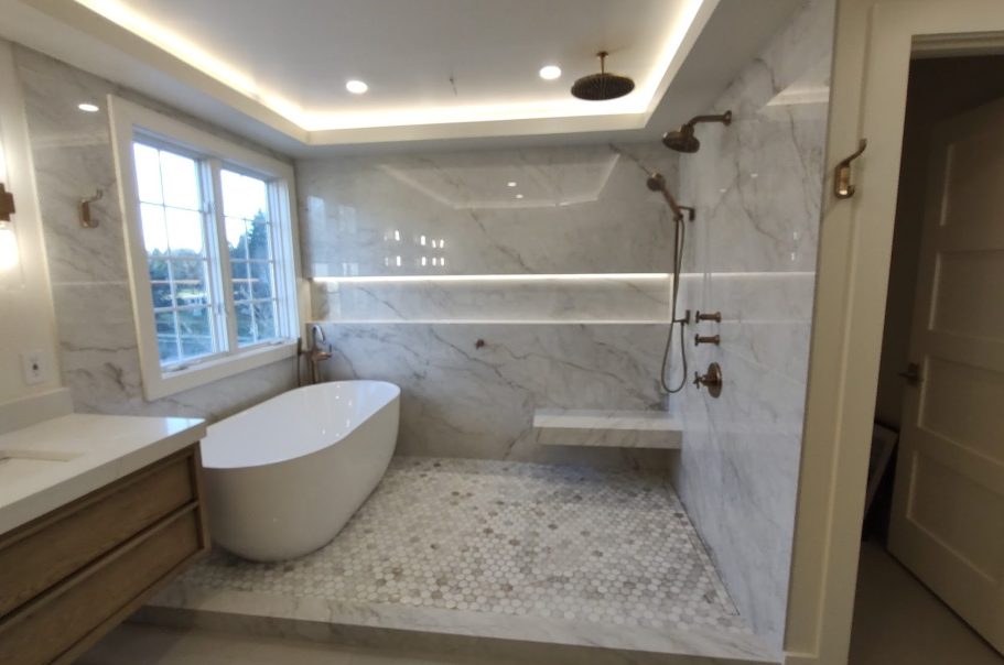 Bathroom remodeling in Horsham pa Modern bathroom featuring a freestanding bathtub, triple showerheads, accent lighting and marble finishes.